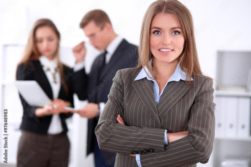 Face of beautiful cheerful smiling business woman on the background of business people Successful business concept Face of beautiful cheerful smiling business woman on the background of business people Successful business concept