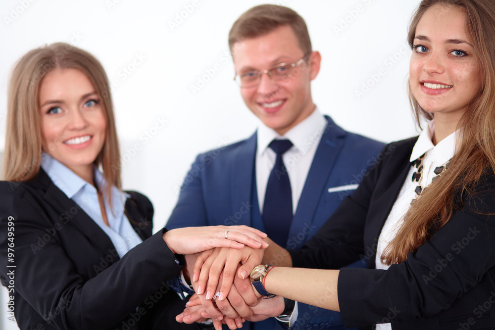 Business people group joining hands and representing concept of friendship and teamwork Business people group joining hands and representing concept of friendship and teamwork