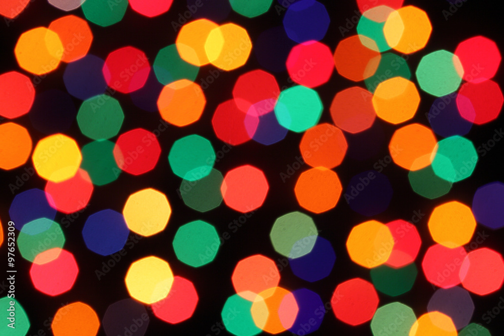 Light garlands on dark background. Christmas lights background.