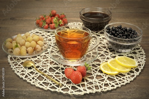 Glass Teacup, Retro Teaspoon, Bowls With Summer Berries And Hone photo