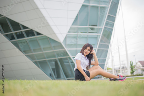 young attractive asian girl in a uniform of university