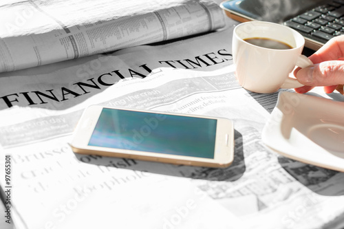 Newspaper with coffee