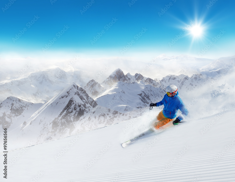 Man skier running downhill