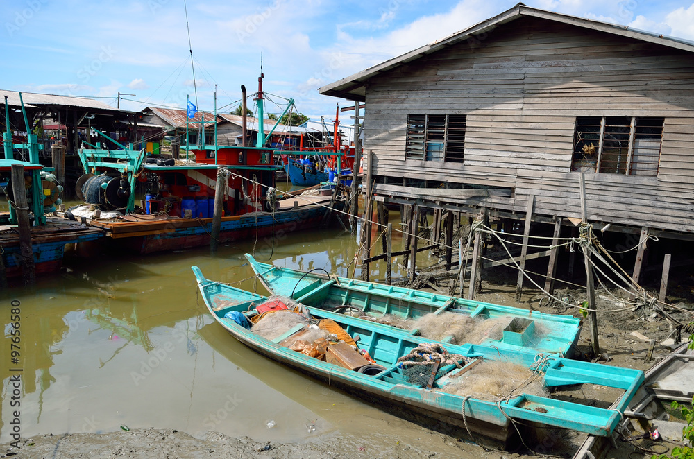 Colorful chinese fishing boat resting at a Chinese Fishing Village- Sekinchan, Malaysia..