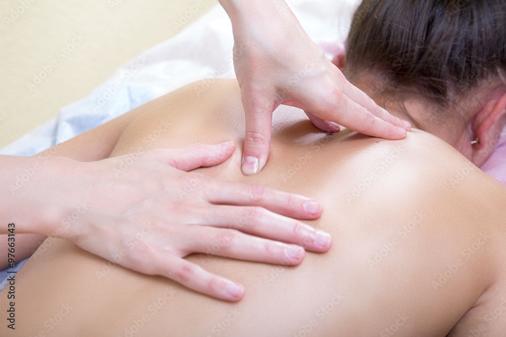 Specialist press on specific points on the back during a massage Specialist press on specific points on the back during a massage