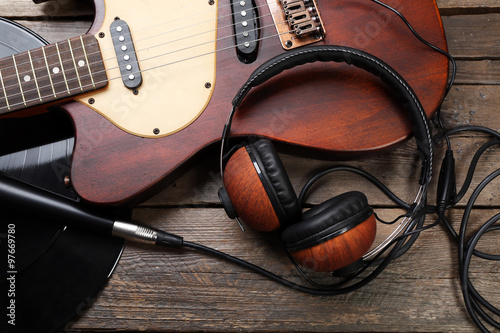 electric guitar headphones on wooden background