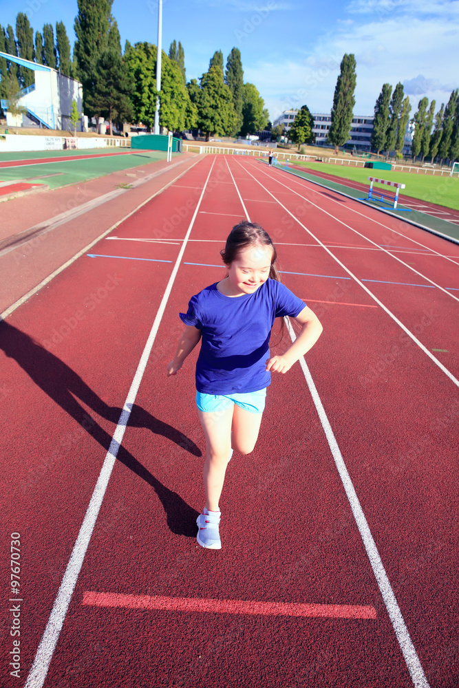 Fototapeta premium Little girl have fun on the stadium