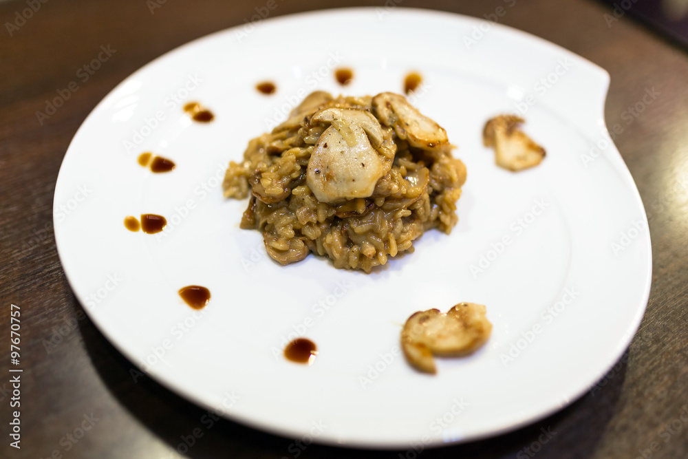 Risotto with cep mushrooms on the plate Risotto with cep mushrooms on the plate