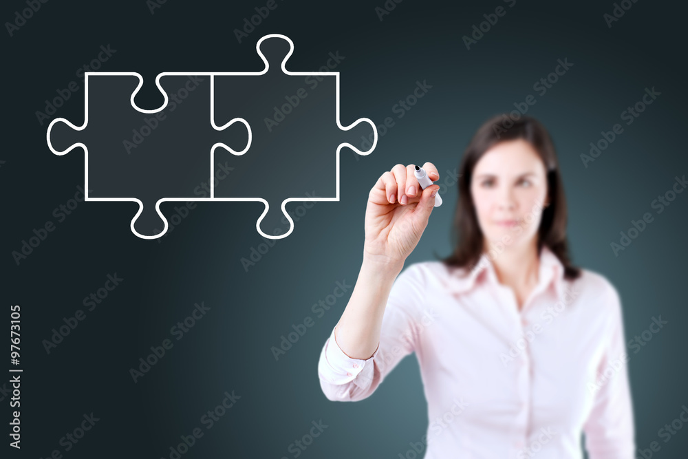 Businesswoman drawing a Blank Puzzle on the screen. Blue background. Businesswoman drawing a Blank Puzzle on the screen. Blue background.