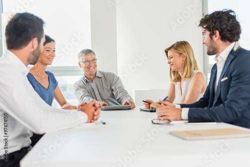 Office business meeting. The team is sitting at a table 
