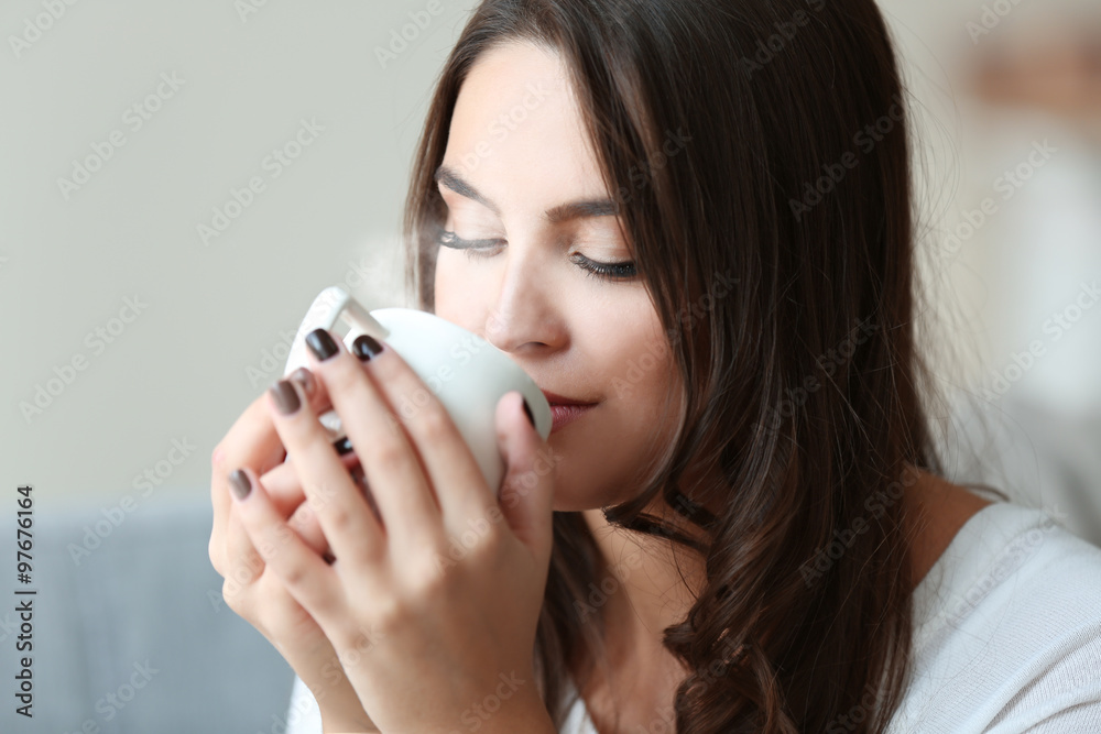 Portrait of pretty young woman with cup of coffee, close up Portrait of pretty young woman with cup of coffee, close up