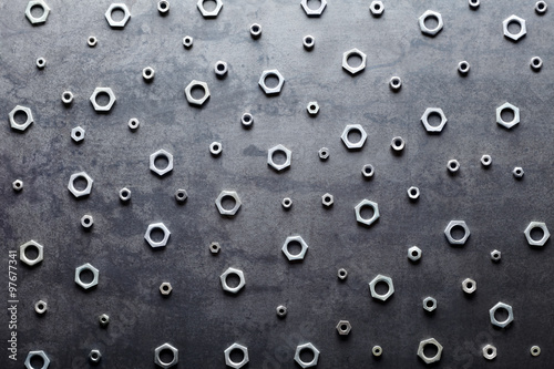 Abstract metal screw nuts background