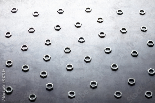 Abstract metal screw nuts background