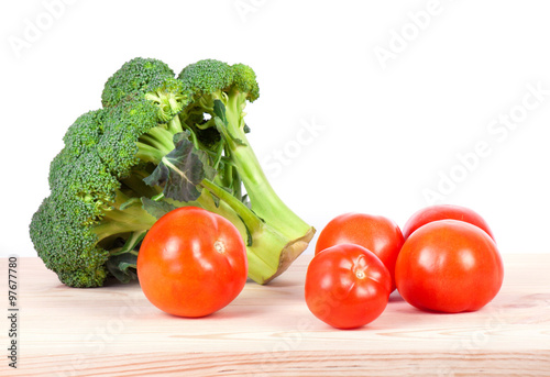 broccoli and tomatoes on wood