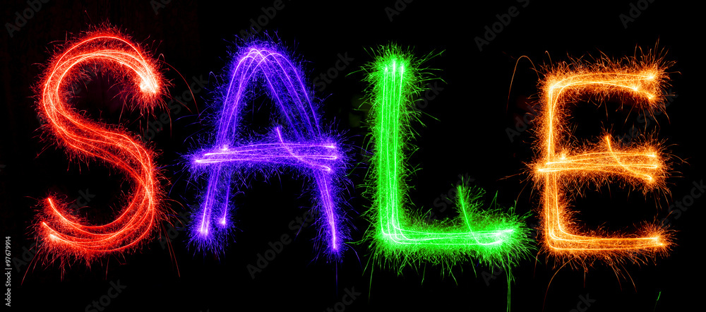 Sparkling inscription of SALE on a black Sparkling inscription of SALE on a black