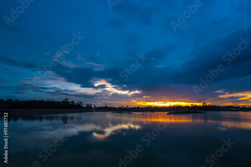 Sunset landscape with blue sky over the lake