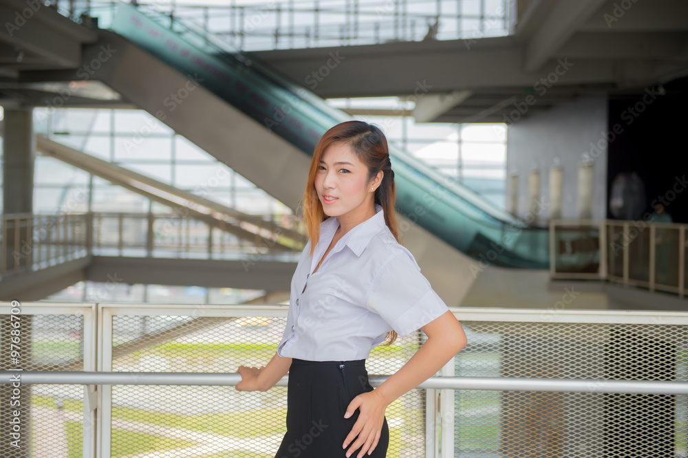 young attractive asian  girl in a uniform of university ,Cute sc