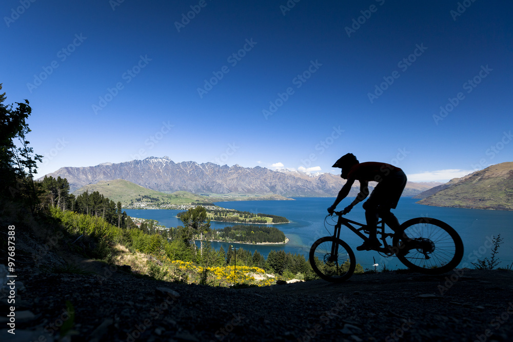 Silhouette of mountain bike rider in Queenstown, New Zealand