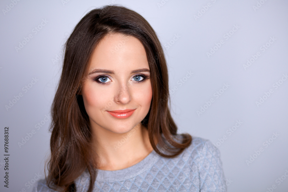 Portrait of an attractive fashionable young brunette woman