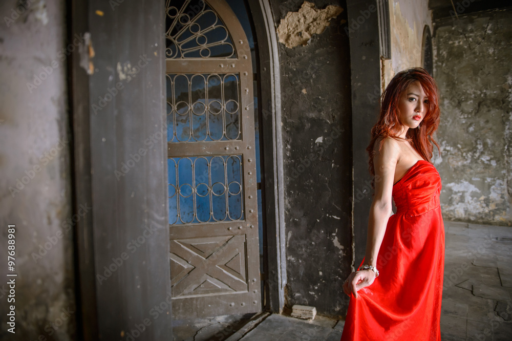 Fashion photo of young  asia woman in red dress