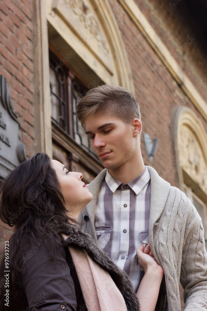 Young couple look at each other