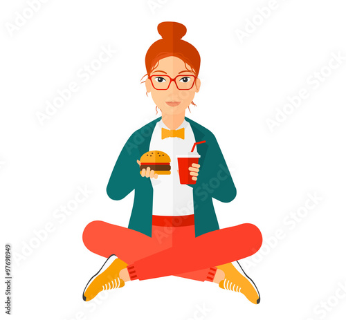 Woman eating hamburger. 