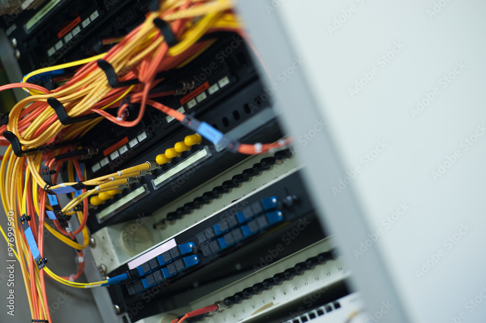 Naklejka premium fiber optic with servers in a technology data center