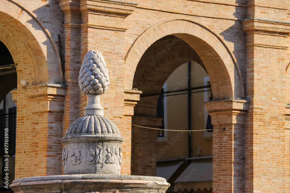 Fototapeta premium Ancient fountain with pinecone on Cavour square in Rimini, Italy