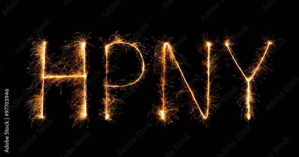 Happy New Year made of sparkles firework at night Happy New Year made of sparkles firework at night