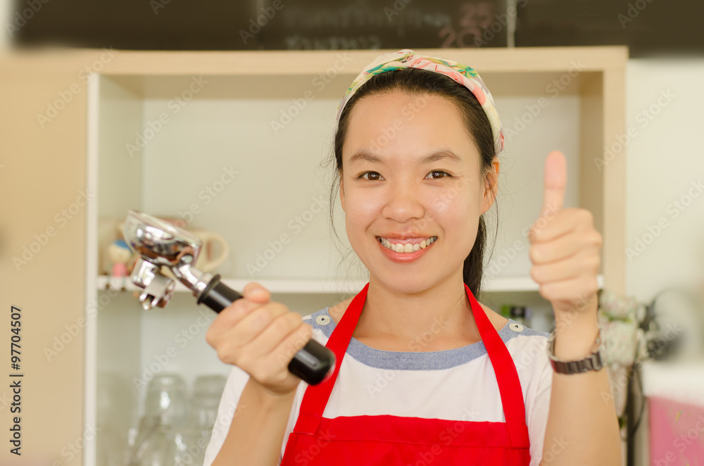 Woman barista preparing service in the coffee shop Woman barista preparing service in the coffee shop