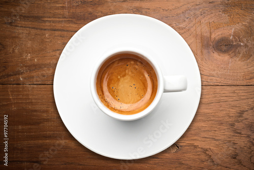 Canvas Print top view a cup of espresso coffee on wooden table