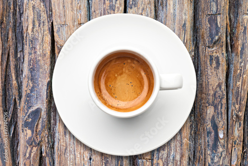 top view a cup of espresso coffee on wooden table © joesayhello