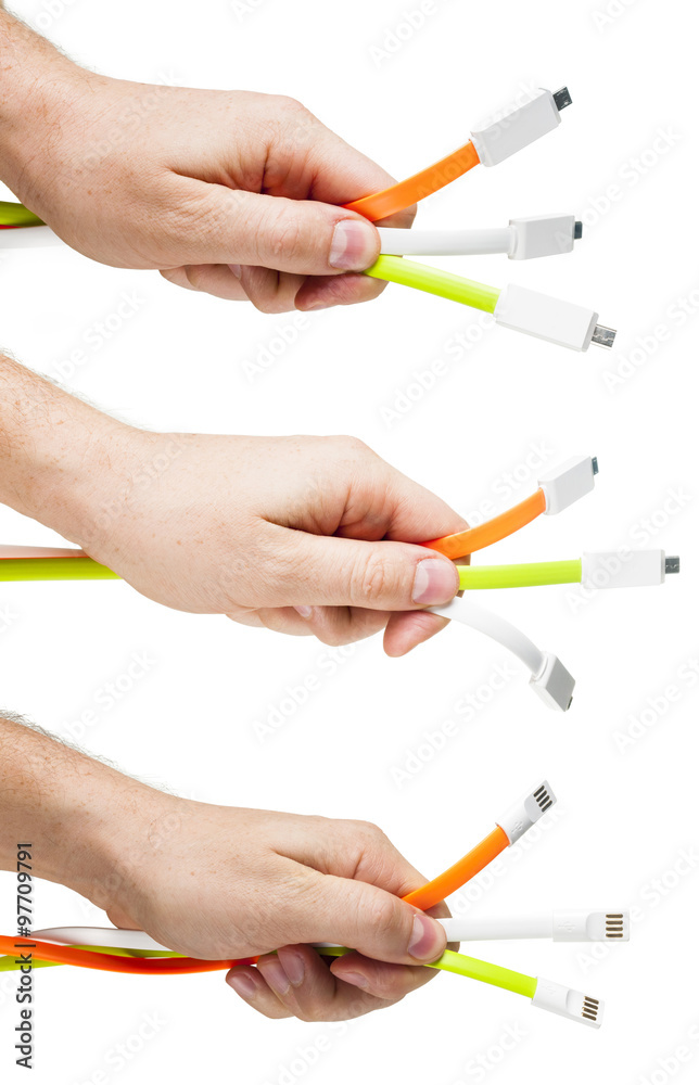 USB cables in the man`s hand. Set. USB cables in the man`s hand. Set.