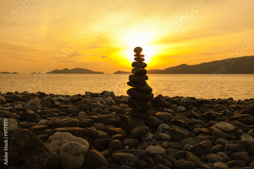 Zen meditation background Balanced stones stack close up on sea