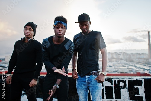 Three rap singers band on the roof photo