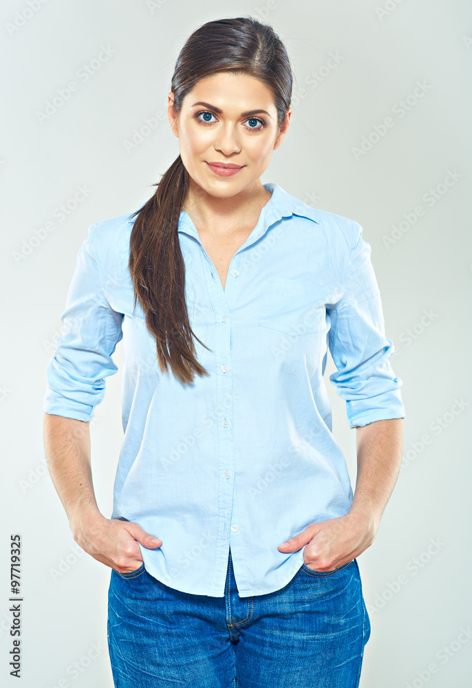smiling woman wearing casual studio portrait isolated on gray.