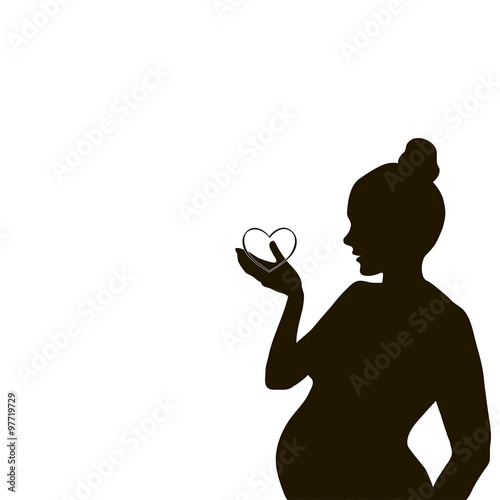 silhouette of a pregnant woman with a heart in his hands