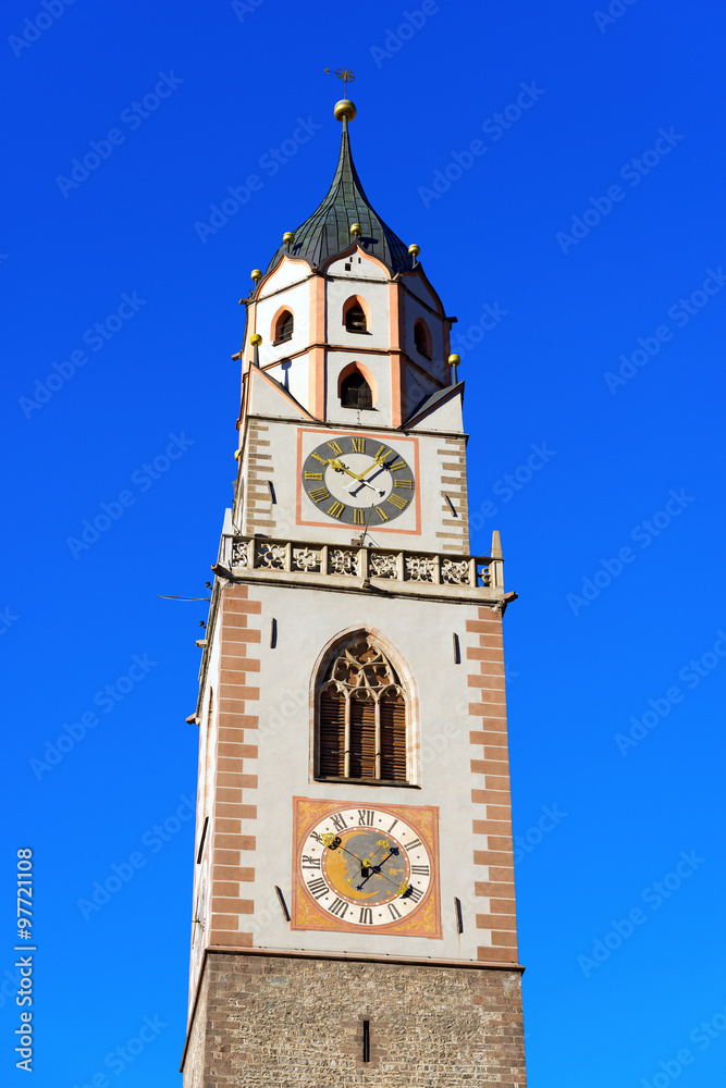 Bell Tower of the Cathedral of Merano - Italy / Detail of the bell tower of the Cathedral of St. Nicholas (1302-1465) in Merano, Bolzano, Trentino Alto Adige, Italy