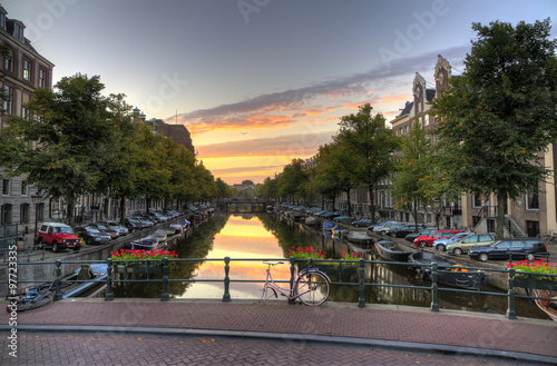 Canvas Print Early morning view from a bridge down a canal in Amsterdam, the Netherlands