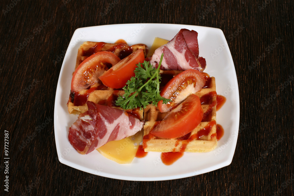 appetizer of bacon and baking in a sauce with tomatoes and chees appetizer of bacon and baking in a sauce with tomatoes and chees