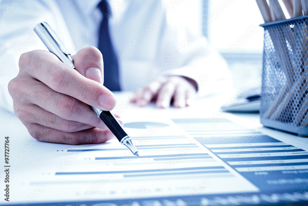 Businessman analyzing investment charts with laptop. Accounting Businessman analyzing investment charts with laptop. Accounting