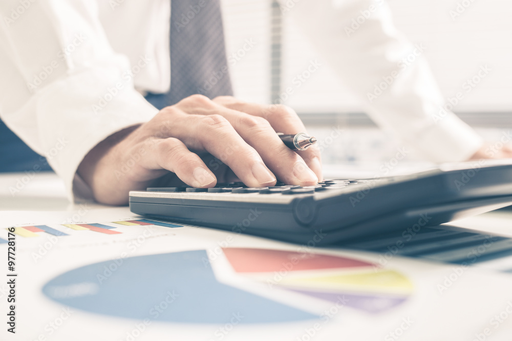 Fototapeta premium Man Analysis Business Report. Accounting