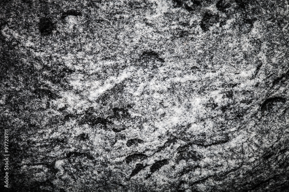 The surface of natural stone as a natural background. Selective The surface of natural stone as a natural background. Selective