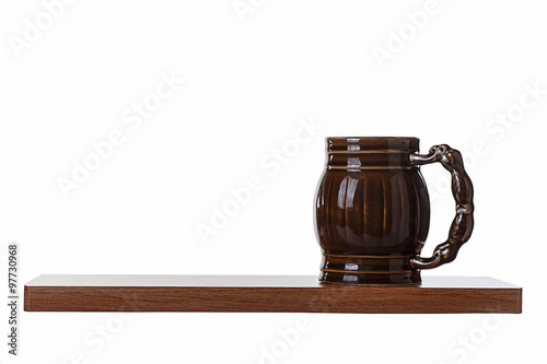 Porcelain beer mug is on the shelf. Objects on a white background