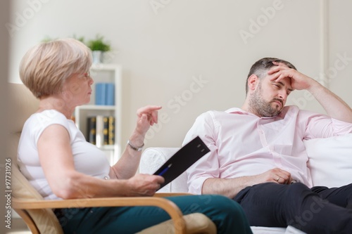 Depressed man with therapist