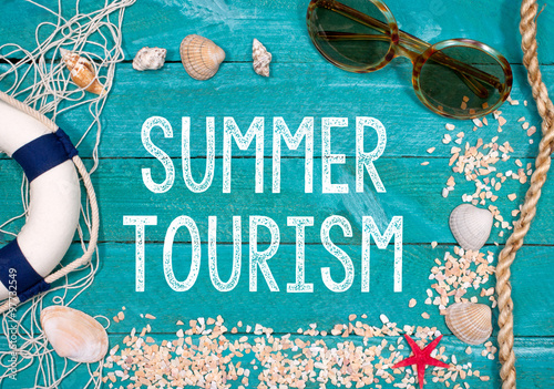 Fototapeta Summer Tourism - beach utensils on turquoise wooden background
