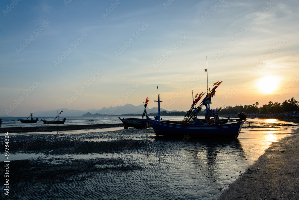 silhouette of Traditional wooden fishing boats on the beach at s