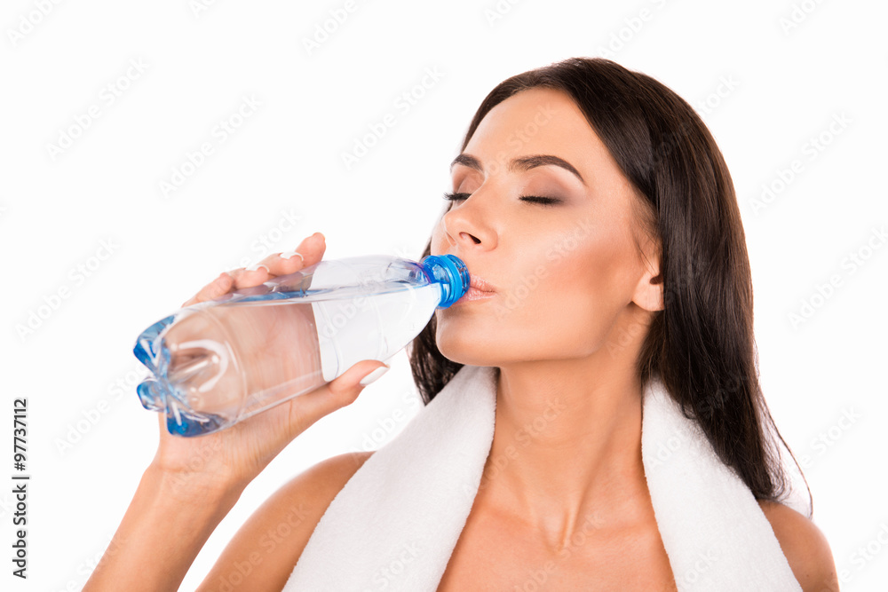 Pretty healthy girl with towel drinking water Pretty healthy girl with towel drinking water
