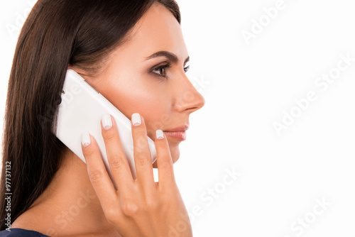 Side view of a beautiful businesswoman talking on the phone