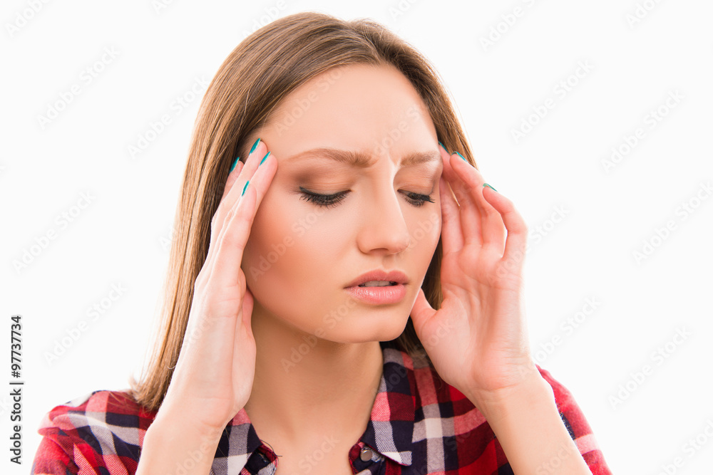 Portrait of young woman with painful expression on her face Portrait of young woman with painful expression on her face